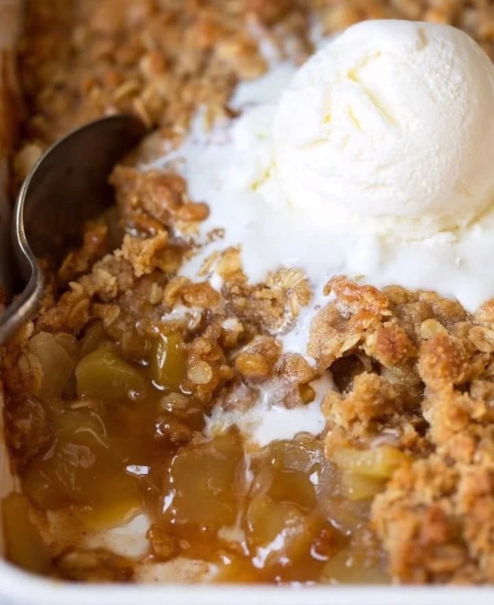 Delicious homemade Apple Crisp with warm apples and a crunchy topping