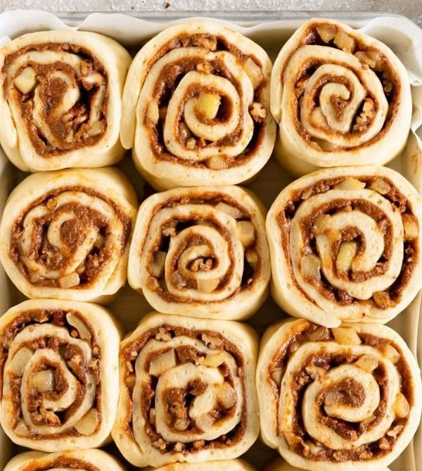 Delicious homemade apple pecan cinnamon rolls topped with icing