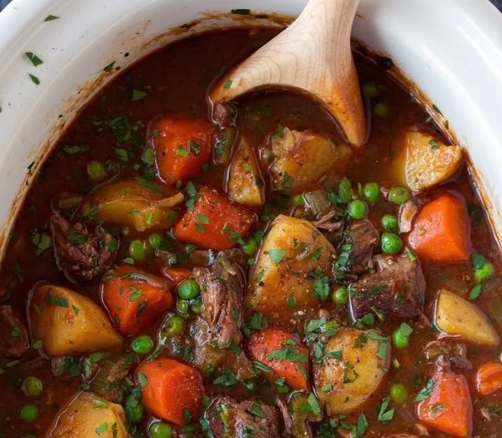 Bowl of the best ever beef stew with vegetables and herbs