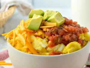 Delicious breakfast burrito bowl with toppings and ingredients