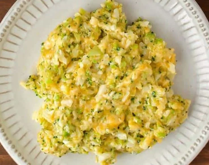 Cheesy broccoli and cauliflower rice served in a bowl