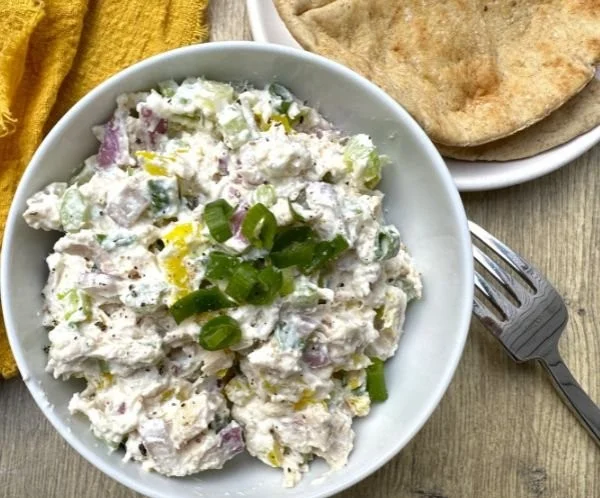 Creamy cottage cheese chicken salad with banana peppers served in a bowl
