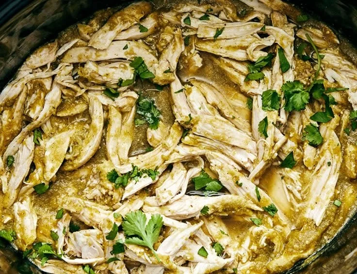 Crockpot Salsa Verde Chicken ready to serve with fresh toppings.
