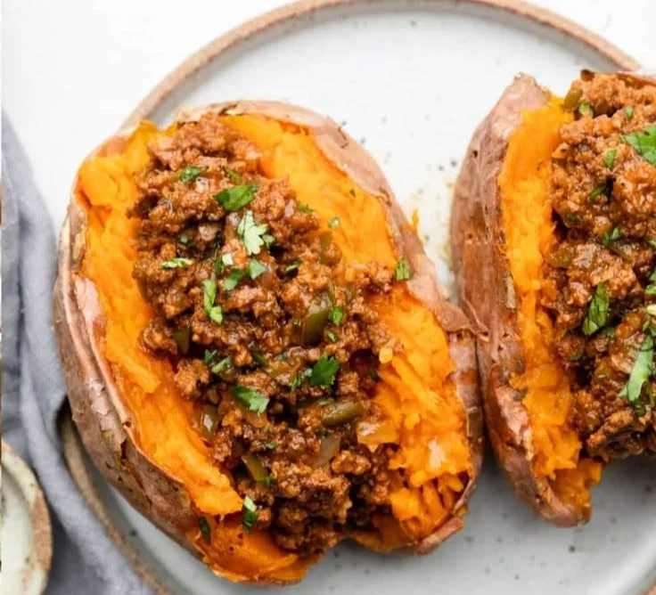 Healthy sloppy joes served on a plate with fresh ingredients.