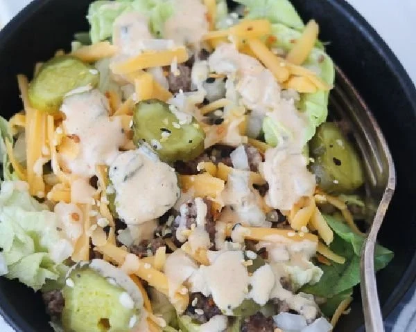 Delicious Keto Big Mac-Style Salad topped with special sauce and fresh ingredients