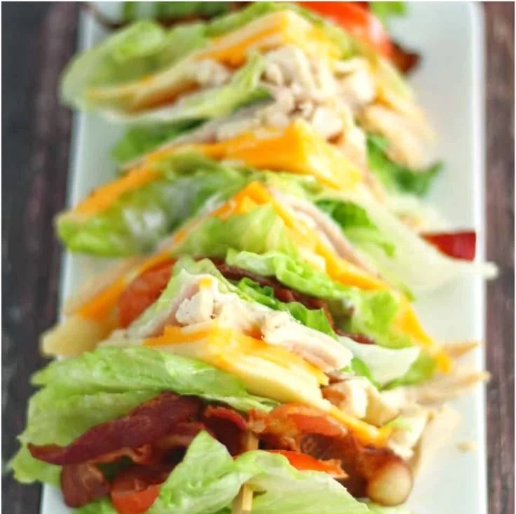 Keto Chicken Club Sandwich with grilled chicken and fresh toppings on a low-carb bread