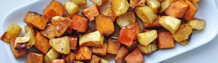Roasted apple cinnamon sweet potatoes served in a bowl