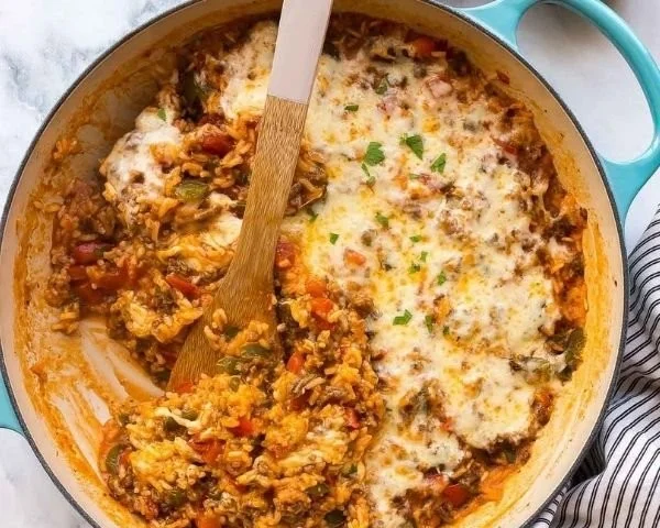 Delicious stuffed pepper casserole served in a bowl with bell peppers and cheese